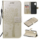 For Samsung Galaxy A32 4G Tree & Cat Pattern Pressed Printing Horizontal Flip PU Leather Case with Holder & Card Slots & Wallet & Lanyard(Gold)