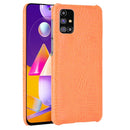 For Samsung Galaxy M31s Shockproof Crocodile Texture PC + PU Case(Orange)